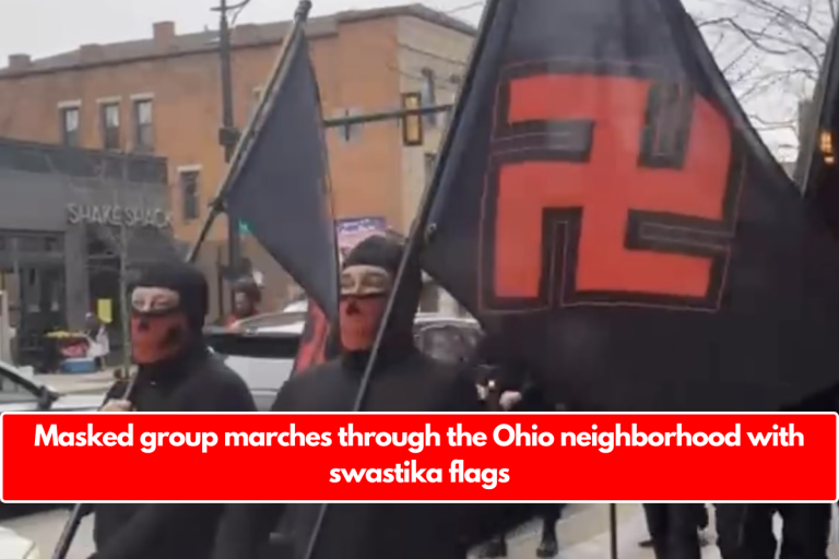 Masked group marches through the Ohio neighborhood with swastika flags